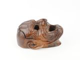 an image of a wooden sculpture of a dog on a white background