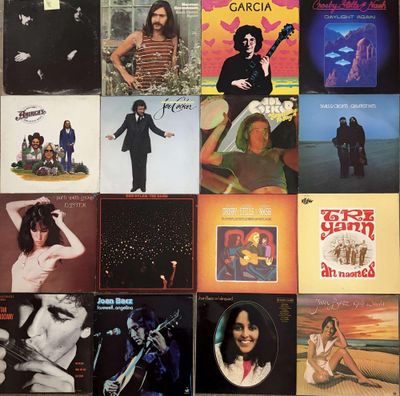 the album covers of various albums are displayed on the wall
