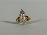 a close up of a diamond ring on a white surface