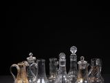 an image of a group of glass vases sitting on top of a table