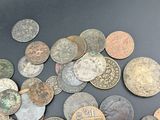 a lot of coins that are on the table