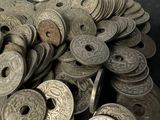 a pile of silver coins sitting on a table
