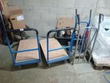 many boxes and a cart in a room
