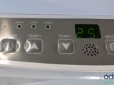 a close up of the controls on a white stove