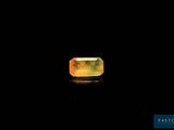 an image of a yellow and green ring on a black surface