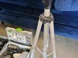 a picture of a tripod with tools in it on the floor