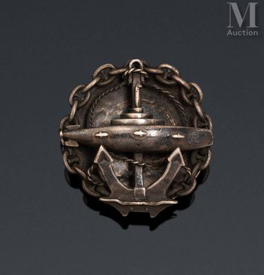 an image of a metal pin with an anchor on it