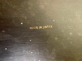 a picture of a metal plate with writing on it