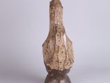 a small vase that is sitting on a table
