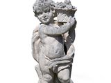 a statue of a boy holding a bird in his hand