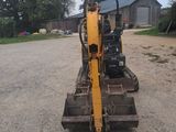 a small machine that is sitting in the dirt