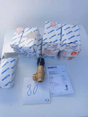 several rolls of toilet paper are sitting on a table next to a water meter