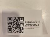 a sticker with a qr code on it sitting on a table