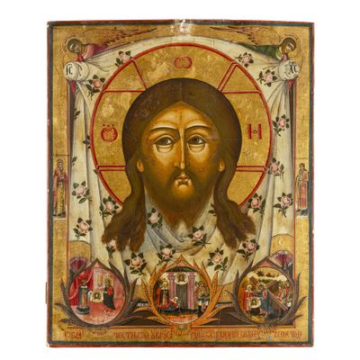 une icône représentant le visage de Jésus, accompagnée de nombreux symboles religieux
