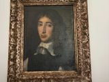 a picture of a painting on the wall above a window