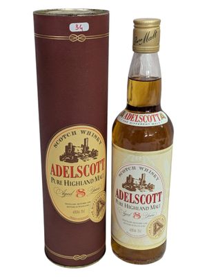 an image of a bottle of whisky next to a cardboard box