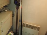 an image of a room with a vacuum and a dryer