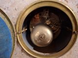 a close up of a clock that is on a table