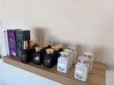 a shelf with a lot of bottles and containers on it