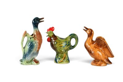 three figurines of birds that are sitting next to each other