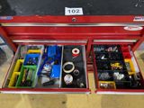 a red tool box with tools inside of it