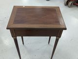 an image of a small table with a drawer on top of it