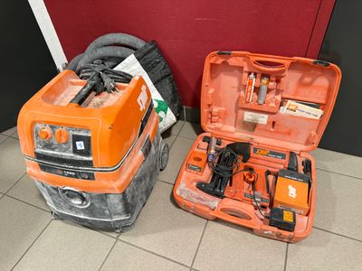 two orange tools in a case on the floor