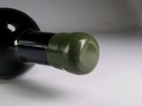 a bottle of wine that is sitting on a table
