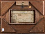 a picture of an old wooden picture frame with writing on it