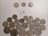 a lot of coins that are on the table