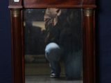 une image représentant un miroir dans lequel se reflète une personne