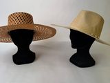 two hats on a mannequin head on a white background