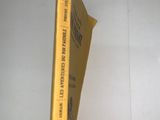 a yellow book that is sitting on top of a table