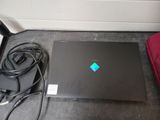 a black laptop with a blue diamond on the screen