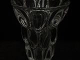 a glass vase that is sitting on a table