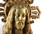 a gold statue of jesus with a crown on his head