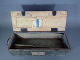 a wooden box with a handle and a stick inside of it