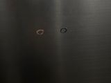 a close up of a metal object with a hole in it