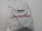 a white bag with a logo on it sitting on a table