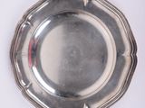 silver plate on a white background with a red stripe around the edge
