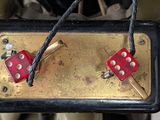 two red dice sitting on top of a black box