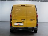 a yellow van that is parked in a room