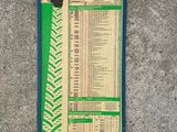 a close up of a sign on the ground with a price list on it
