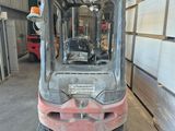 a forklift truck that is parked in a warehouse