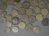 a lot of coins that are on the table