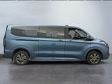 the blue van is parked next to a white wall in a garage