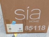 a cardboard box with a sticker on it that says sia home