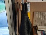 a coat rack with a bunch of coats hanging on it