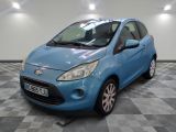 a picture of a small blue car parked in a garage