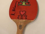 a ping pong paddle with a drawing on it